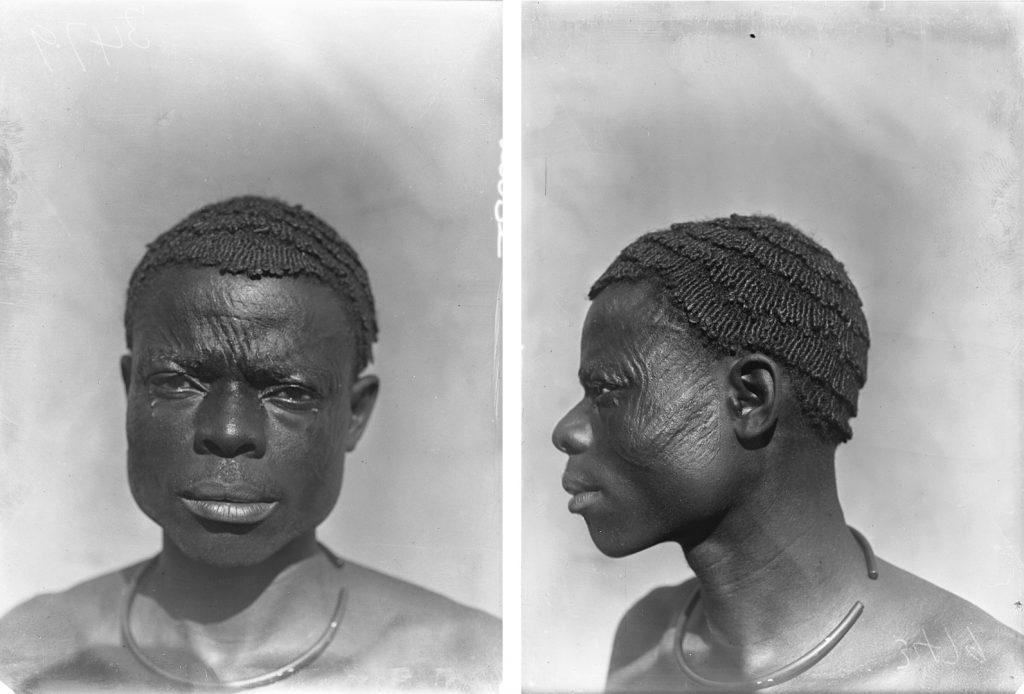 Physical type portrait of Nwobu, man with ichi scarification marks, photographed by Northcote Thomas in Amansi, Nigeria, 1911