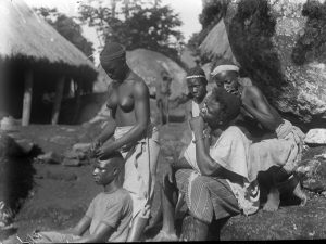 Yagala, Sierra Leone. Plaiting hair.