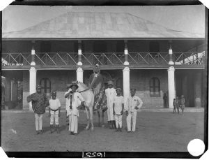 Chief Iyamu, photographed by N. W. Thomas in front of Egedege N'okaro, Benin City in 1909