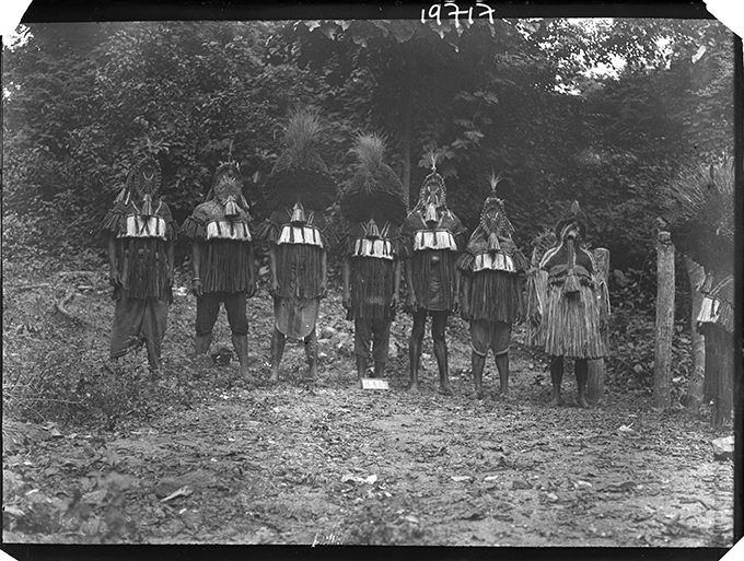 Northcote Thomas's photograph of the Eliminya masquerade costumes, Otuo, July 1909. NWT 840. RAI 400.19717.